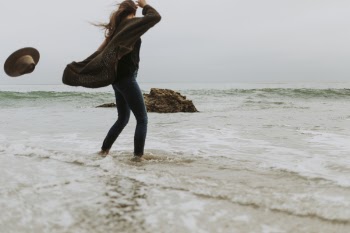 Woman Standing Near Seawater