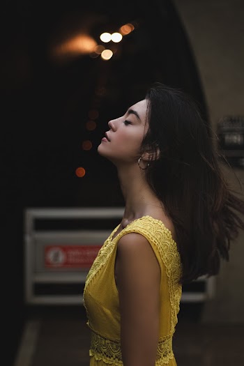 Woman Standing Near Signage