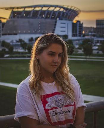 Woman Standing Near the Fence on Shallow Photo