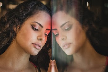 Woman Standing Near the Glass Mirror