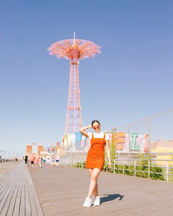 Woman Standing Near Tower