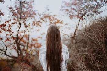 woman standing near tree during daytime
