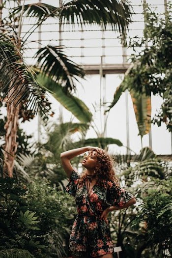 woman standing near trees