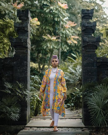 Woman Standing Near Two Walls