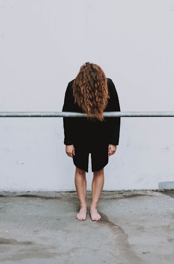 Woman Standing Near Wall