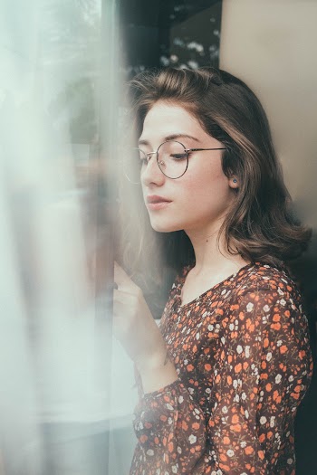 Woman Standing Near Wall