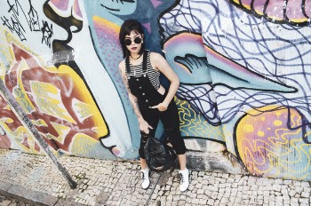 Woman Standing Near Wall With Graffiti