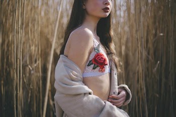 woman standing near wheat field