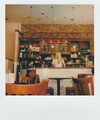 Woman Standing Near White Counter Desk