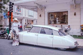 Woman Standing Near White Vehicle 