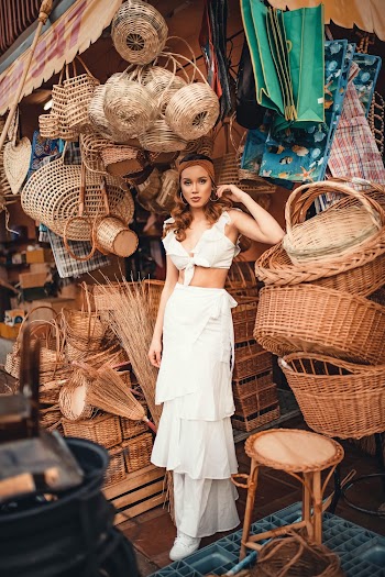 Woman Standing Near Wicker Baskets