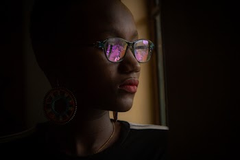 Woman Standing Near Window