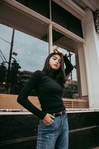 Woman Standing Near Window