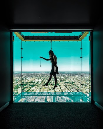 Woman Standing Near Window