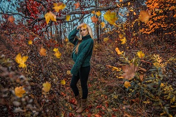 Woman Standing Near Yellow Trees