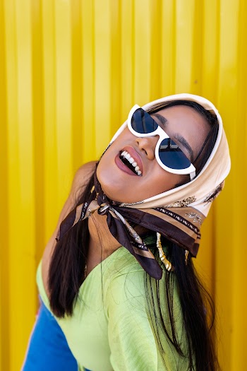 Woman Standing Near Yellow Wall