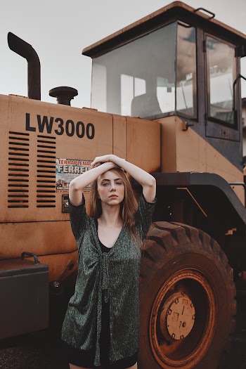 Woman Standing Next to Heavy Equipment