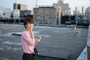 Woman Standing on a Building Rooftop