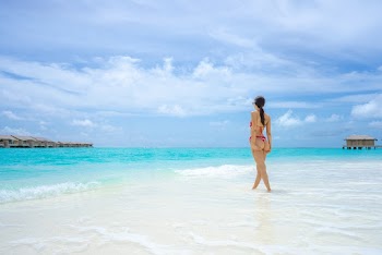Woman Standing on Beach