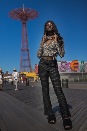 Woman Standing on Boardwalk