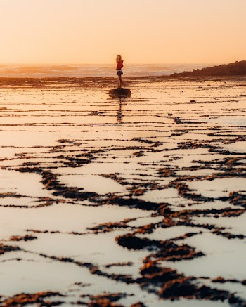 Woman Standing on Body of Water