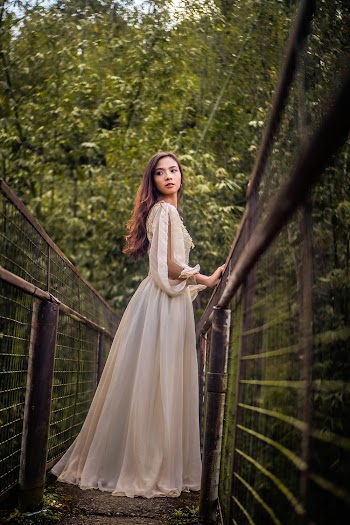Woman Standing on Bridge