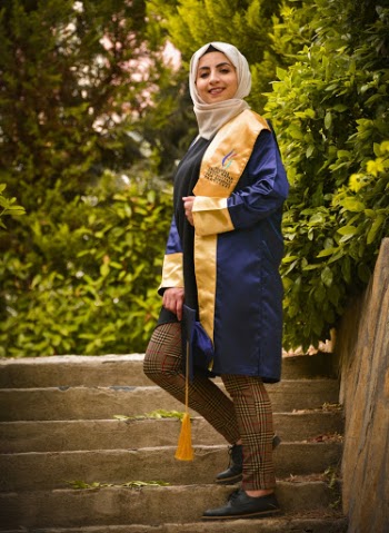 Woman Standing on Brown Concrete Staircase