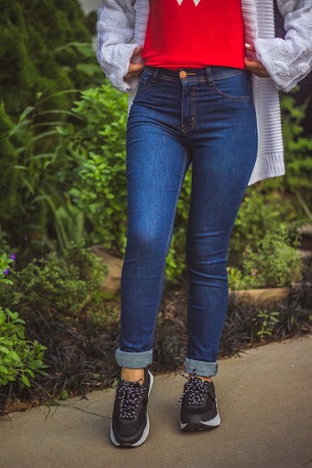Woman Standing on Brown Pathway