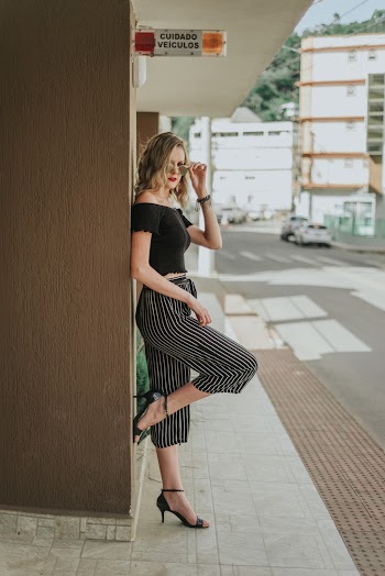 Woman Standing on Cabinet