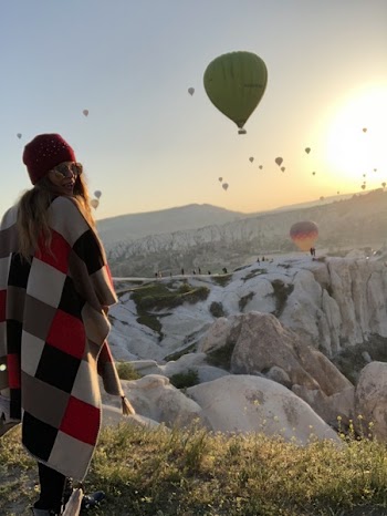 Woman Standing on Cliff