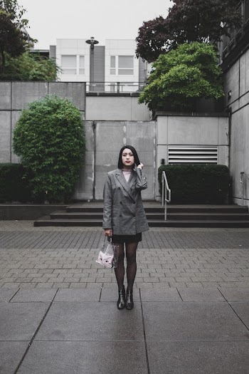 Woman Standing on Concrete Ground
