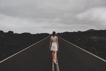 Woman Standing on Concrete Road