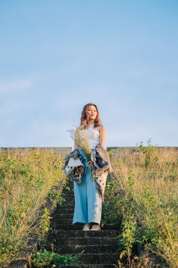 Woman Standing On Concrete Stairs