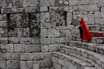 Woman Standing on Concrete Stairs