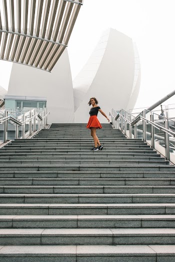 Woman Standing on Concrete Steps