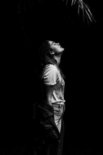 woman standing on dark place