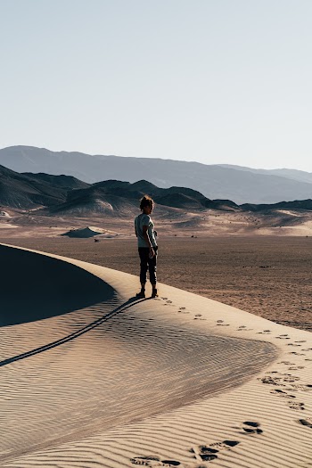 Woman Standing on Desert