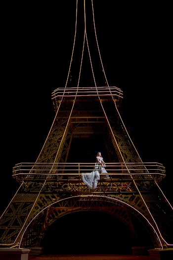 Woman Standing on Eiffel Tower Stand