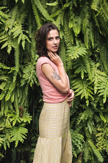 Woman Standing on Front of Green Landscape