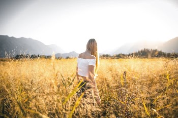Woman Standing on Grass