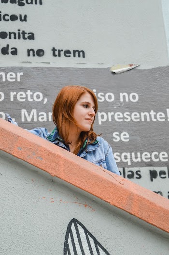 Woman Standing on Gray and Orange Staircase