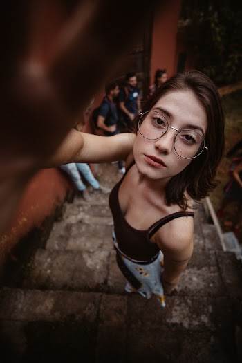 Woman Standing on Gray Concrete Stairs