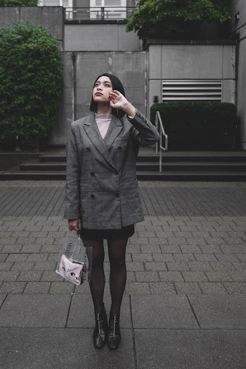 Woman Standing on Gray Pavement Wearing Gray Coat