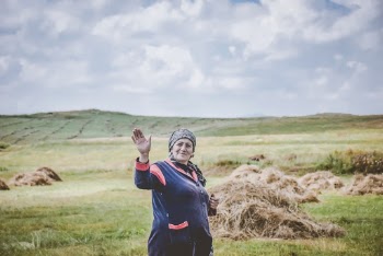 Woman Standing On Green Grass