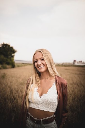 woman standing on green grass field