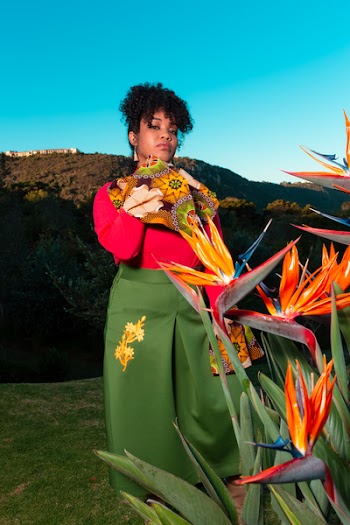 Woman Standing on Green Grass Lawn