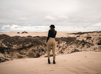 Woman Standing on Hill