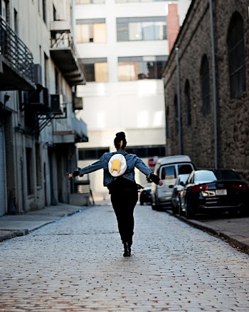 Woman Standing on Pathway Near Building