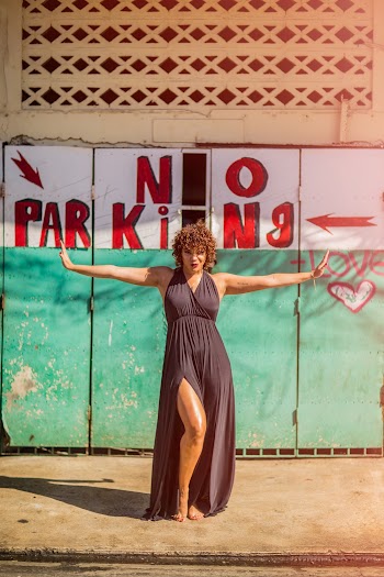Woman Standing on Pavement