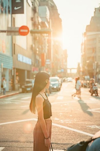 woman standing on road